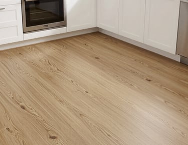 A professional fitting a solid wood door into a stylish modern doorway.