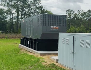 A 500kw Generac Industrial Generator installed on a platform next to the power station