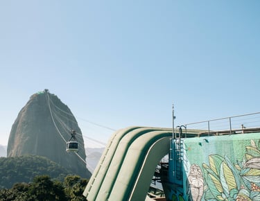 a man on a slider in the mountains