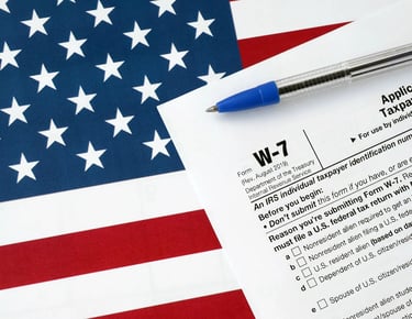 a pen. W-7. Itin number. Taxes. Accounting. ITIN Number in USA