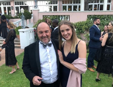 Father-daughter artists Martin and Samantha Osner at a formal gathering.