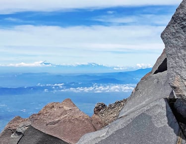 Popocatépetl and Iztaccíhuatl Seen on the Distant Horizon from Pico de Orizaba, Puebla, Mexico