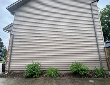 a photo of siding that a pressure washed and got all the dirty algae off