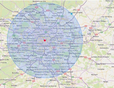 Carte montrant une zone de couverture autour de Paris avec un point central en rouge et un cercle bleu indiquant un rayon d’i