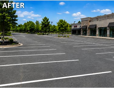 Asphalt parking lot with fresh parking stalls