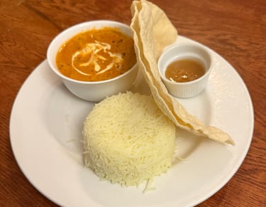 Rice and Poppodum serverd with and Indian curry
