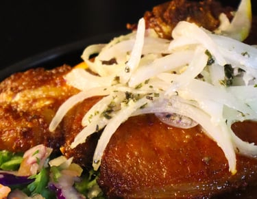 a plate of food with meat and vegetables