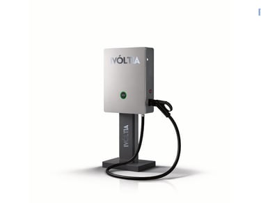 iVoltia sleek silver electric vehicle charging station with integrated cable and pedestal mount.