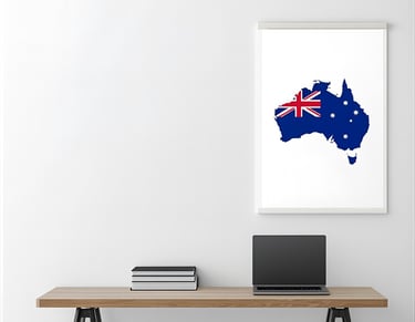 Desk with a laptop and map of Australia for learning English for relocation