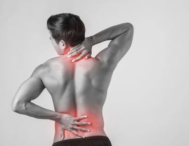 Person holding neck and lower back with red highlights showing pain and discomfort in spine area
