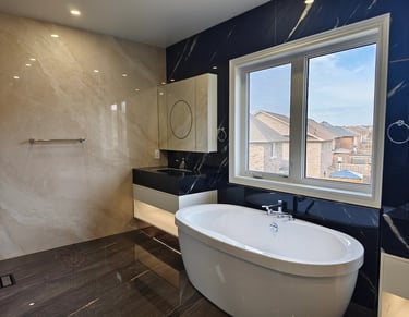 Close-up of a custom bathroom vanity showing the precision alignment of gold metal trim, marble back