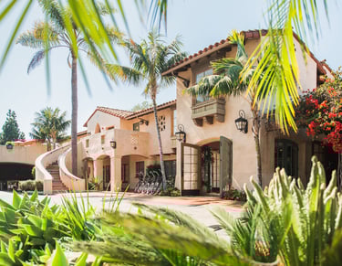 Brisas del Mar Inn at the Beach exterior with palm trees