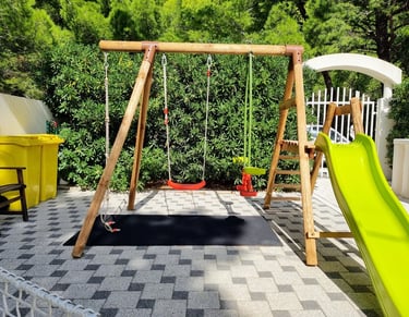 The photo shows the children's swing from another angle.