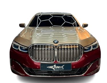 BMW 7 Series wrapped in gold and maroon two-tone vinyl finish