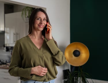 Woman holding a phone and smiling