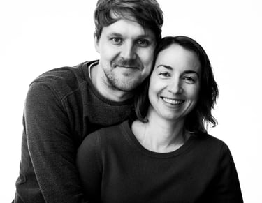 A black and white portrait of a young couple.