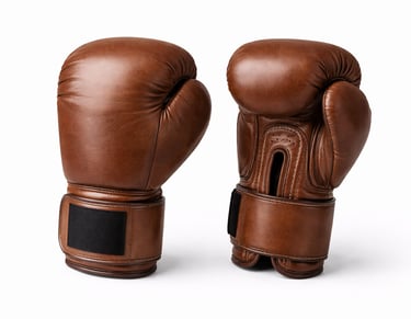 Brown leather boxing gloves with padded knuckles and wrist support for training and professional use