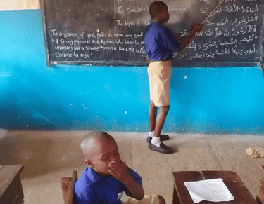 Children learning and teaching Qur’an in a Sierra Leone village school – Maakitheena