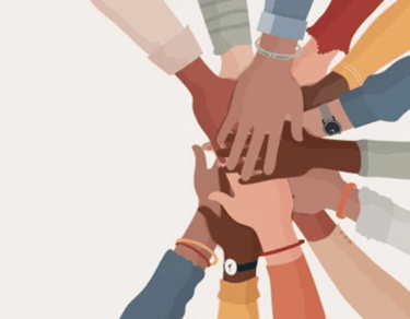 a group of people holding hands together in a circle
