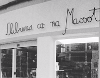 a store front of a store with a woman in a dress