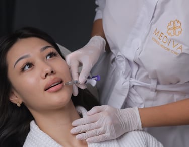A woman gets an injection in her lips 