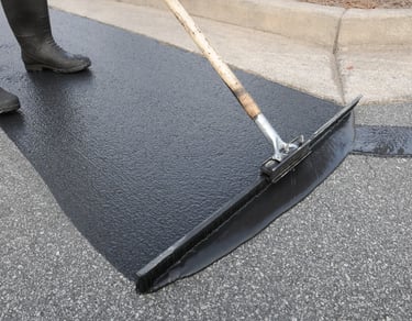 sealcoat spread on parking lot as a final finish