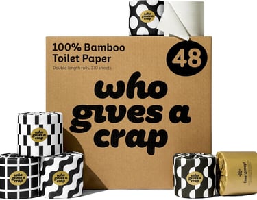 a box of toilet paper rolls with a black and white polka dot