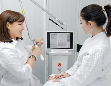 a woman in a white robe is looking at a computer screen