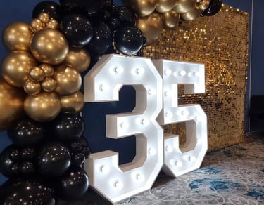 Gold Shimmer Wall featured at a 35Th Anniversary in Wynnum, Brisbane - party hire by SweetAz Co.