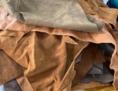 light coloured off cut pieces of suede 