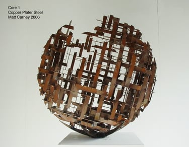 a copper plated steel cross-hatched sphere shaped sculpture