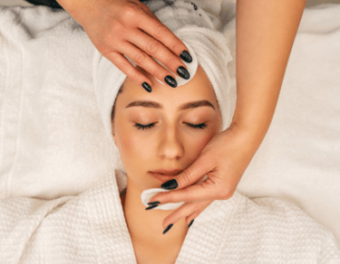 a woman getting a facial lift in a spa