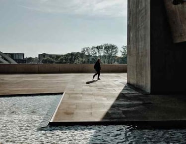 Newly finished commercial stamped concrete project with a brown and gray stamped pattern by Custom