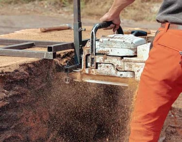 A Custom Concrete worker cutting and sawing concrete for professional finish