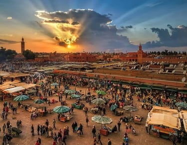 a large group of people standing around a market