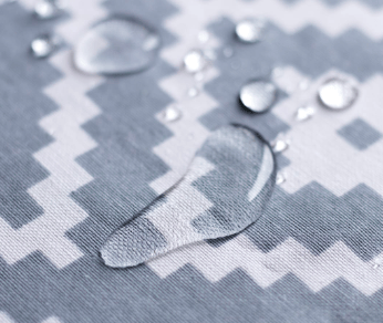 close up of a piece of fabric repelling water