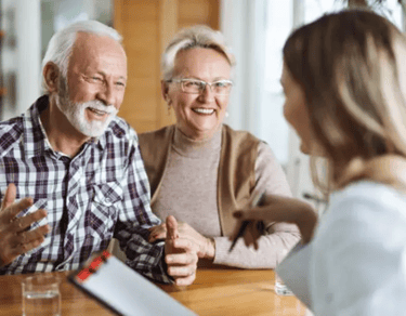 an older couple talking to their doctor
