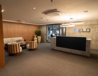 a reception area with a reception table and chairs