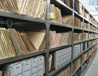 a large collection of files and folders in a large room