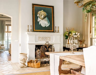Fireplace with artwork and rustic decor at Finca Santa Katerina