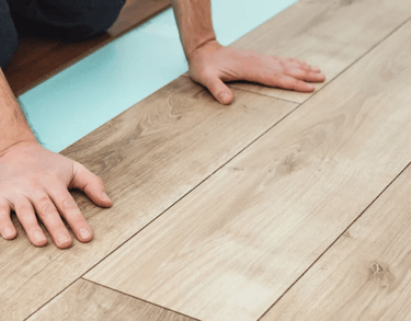 Flooring installer is installing floating type flooring.