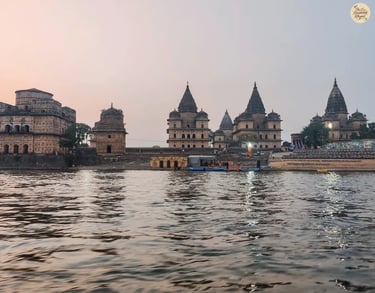 Scenic view of Orchha's royal cenotaphs from a boat on the Betwa River.