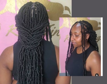 A woman with long, neatly styled faux locs, flowing effortlessly down her back. The smooth, well-crafted locs create a sleek