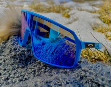 Oakley sports goggles sitting on a rock