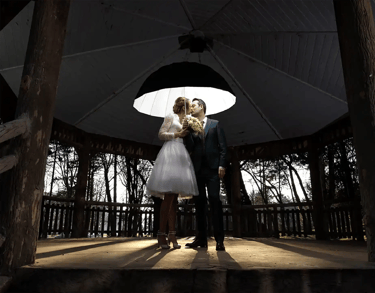 celebre weeding photographer florent lille-paris bride and groom standing under a white umbrella