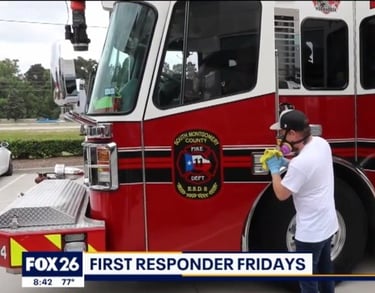 Technician cleaning fire truck