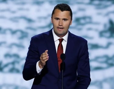 a man in a suit and tie is giving a speech