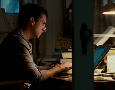 Man on laptop. Still from Dan in Real Life