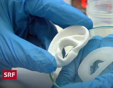 a person wearing gloves holding 3D printed ear and bioprinter ear
