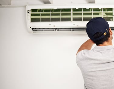 Technician performing AC maintenance as part of Coolline’s AC Repair Service in Greater Noida.